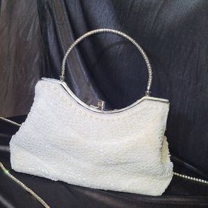 Never used! New vintage handheld clutch